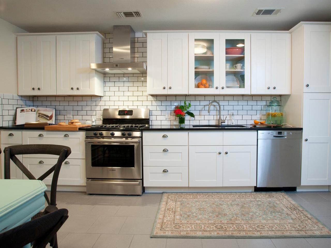 contemporary white kitchen with subway tiles