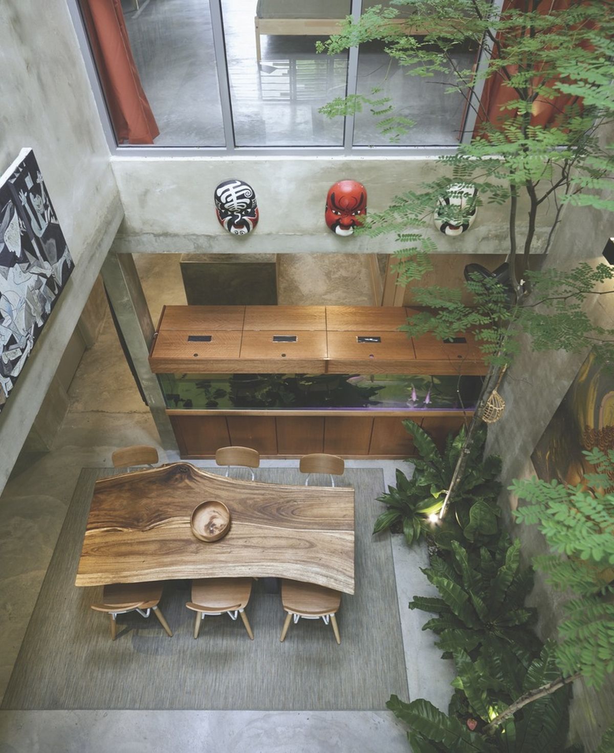Reinvented courtyard home in Malaysia live edge dining table