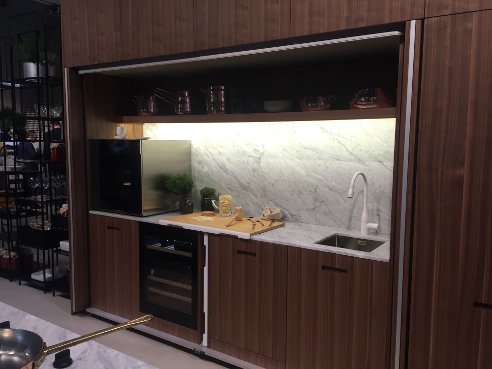 Contemporary brown kitchen design with pocket doors
