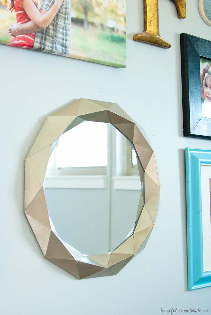 I cannot believe what she used to make this mirror! Decorating your home can get expensive, unless you get creative. This easy $10 Anthropologie mirror knock off tutorial shows you how to get huge style without the huge price tag. 