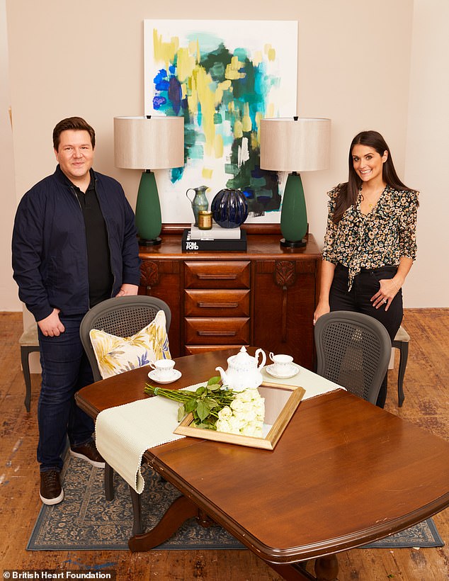 After: Sarah, who runs a studio in Elstree, Hertfordshire, explained the room was built around the £80 wood sideboard, pictured between Sarah and Grant in the transformed dining room