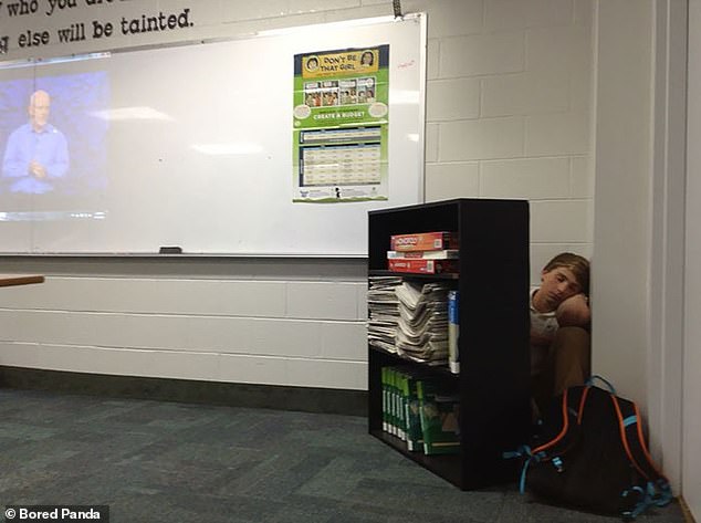 A student who had little interest in watching a personal finance video, decided to sleep hidden behind a bookshelf