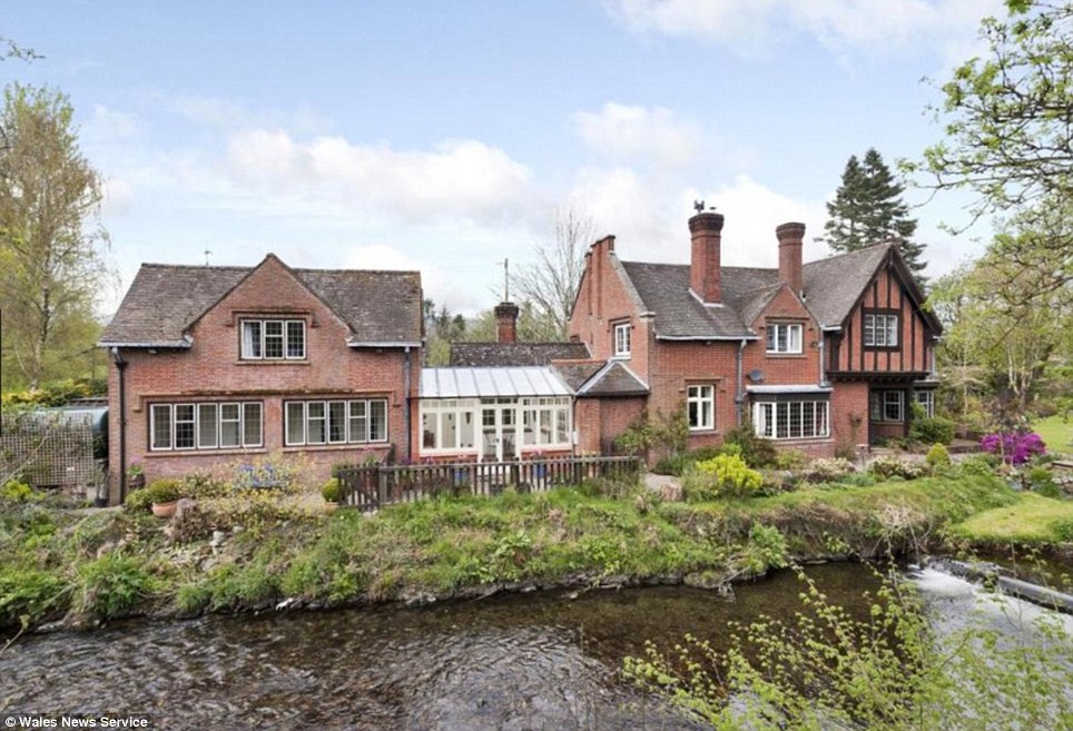 Country living: The five-bedroomed house is near Welshpool, in mid Wales, and comes with its own fishing rights