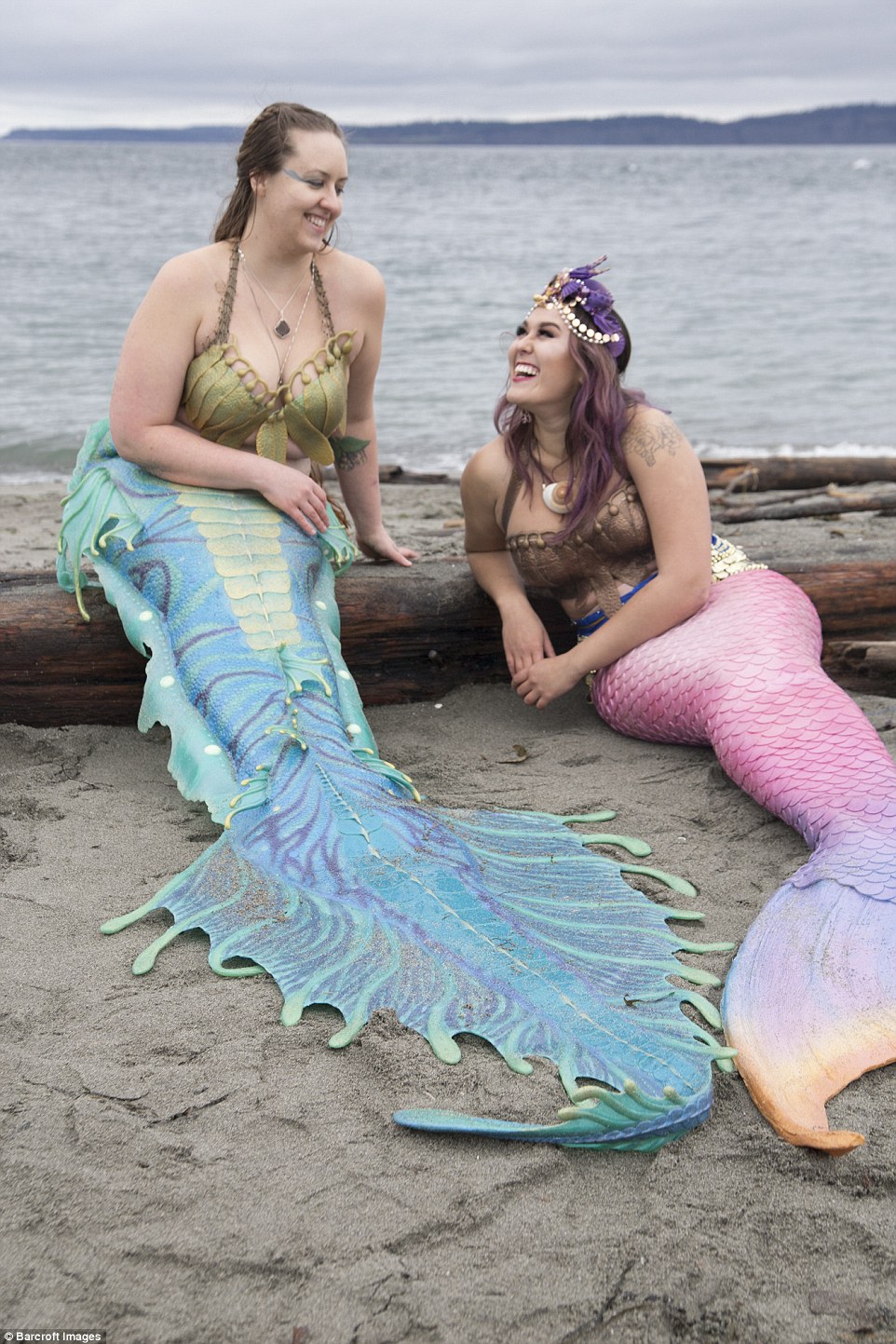Caitlin (pictured with her friend Tessie, right) quit her job in 2015 to focus on her life as a mermaid. She created the sea serpent inspired tail in this photograph - it took her a year to make from silicone