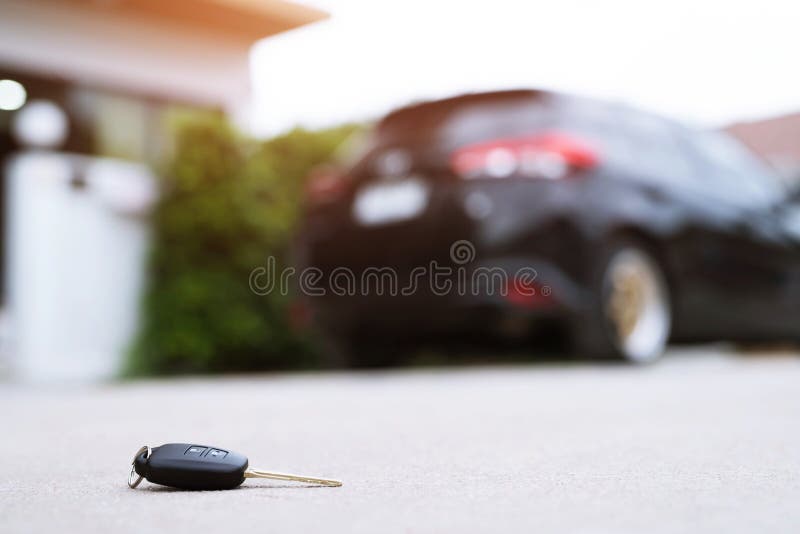 Abstract lost car keys fall lying on the street concrete cement ground roadway home front yard. transportation concept. Abstract lost car keys fall lying on the royalty free stock image