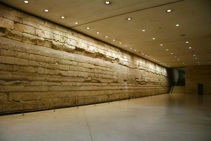 Ancient wall in hall. Under Louvre museum royalty free stock images