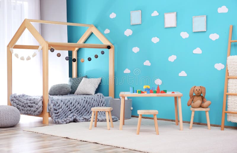 Beautiful child room interior with wooden furniture. And toys stock image