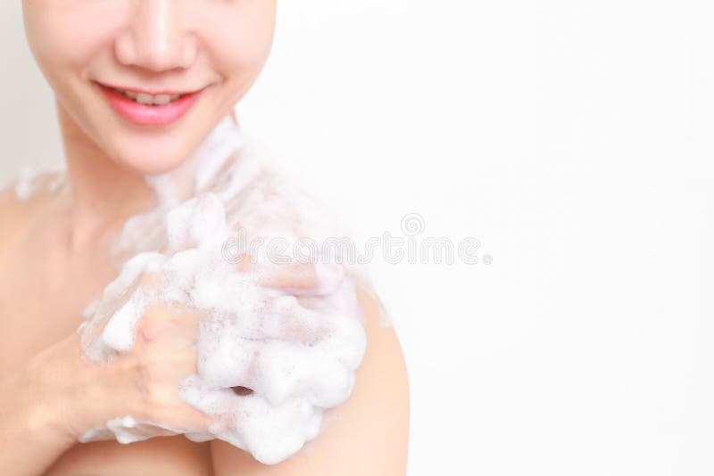 Beautiful girl washing her body shower gel in bathroom. Beautiful girl washing her body shower gel in bathroom royalty free stock image