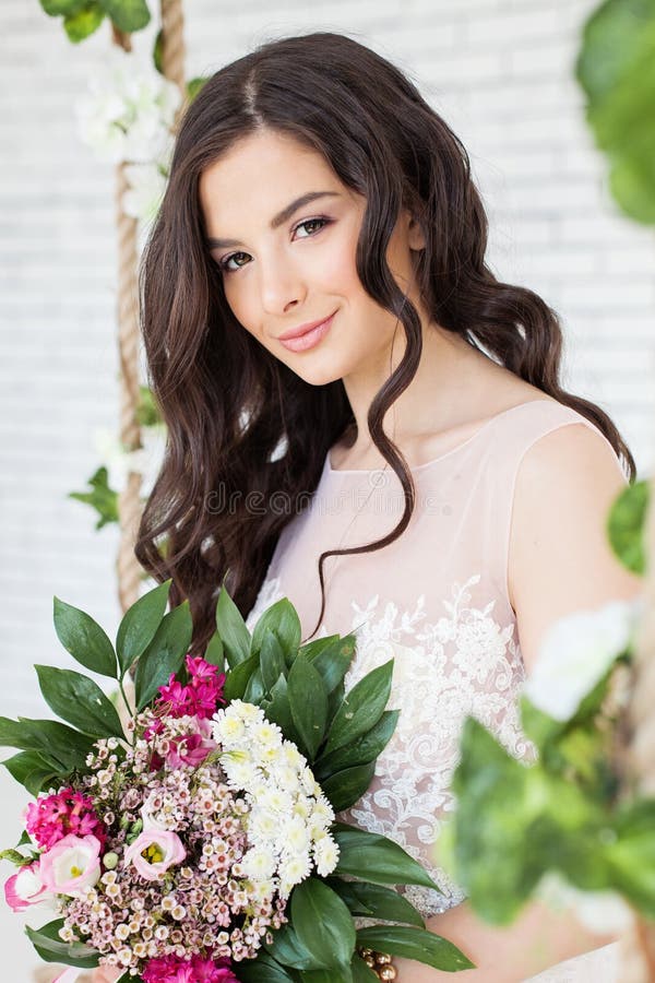 Beautiful Woman with Flowers, Curly Hairstyle royalty free stock photography