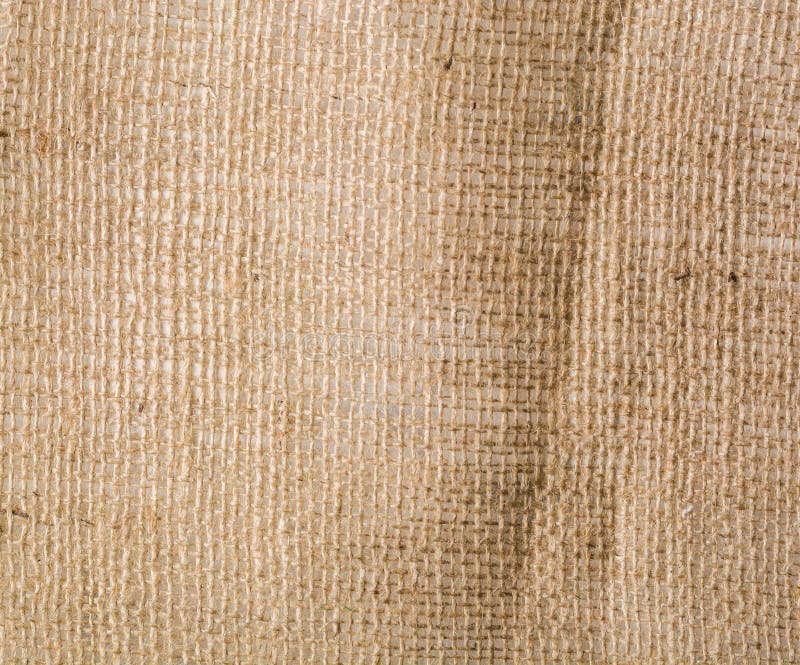 Brown background crumpled and rough burlap. A lot of empty space royalty free stock images