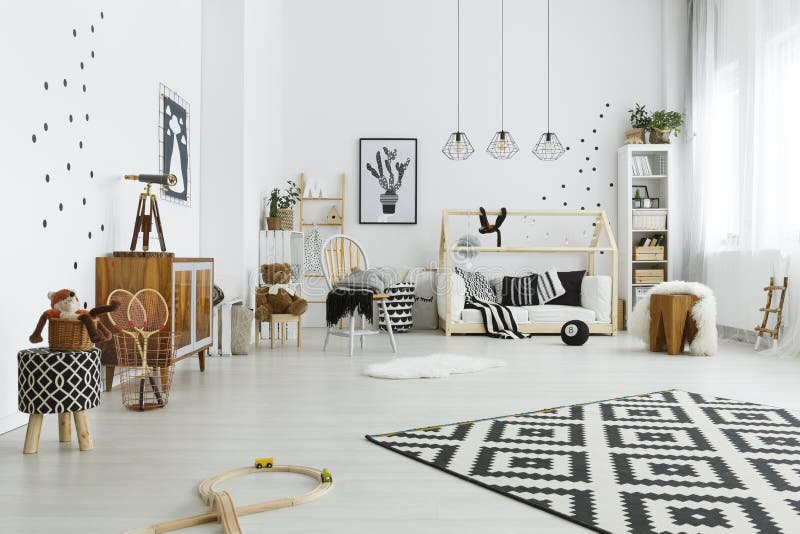 Child room in scandinavian style. With house bed and carpet stock images