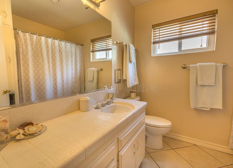 Clean and cozy bathroom in cottage style home southern California San Diego townhouse on the bay in real estate shoot stock images