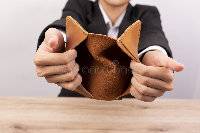 Close up of hand opens an empty wallet royalty free stock images