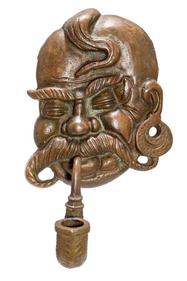 Copper wall mask of the Ukrainian Cossack with a tube stock photography