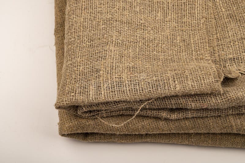 A few pieces of burlap. Fabric with a rough texture for sewing bags. surface texture Close-up.  royalty free stock photo