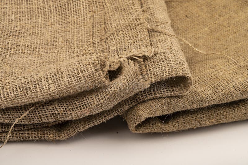 A few pieces of burlap. Fabric with a rough texture for sewing bags. surface texture Close-up.  royalty free stock photo