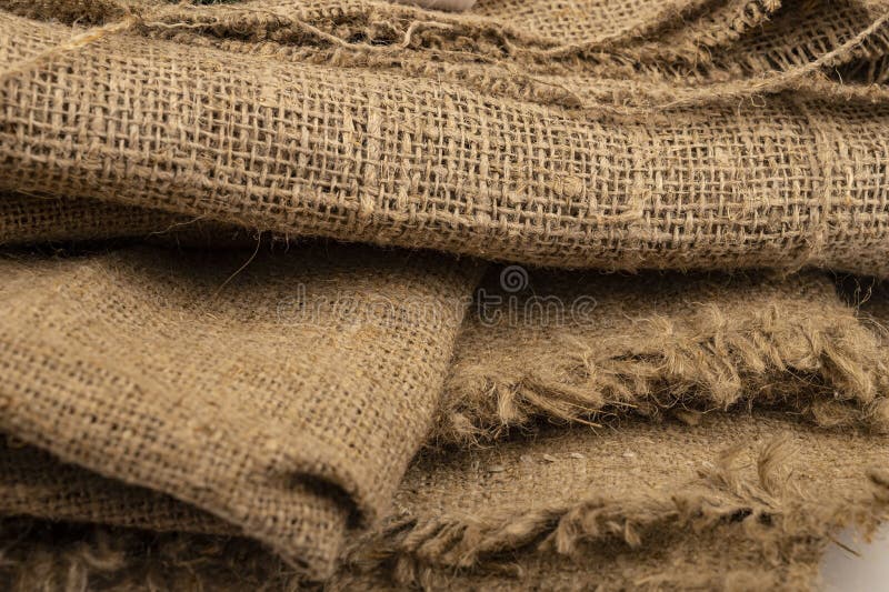 A few pieces of burlap. Fabric with a rough texture for sewing bags. surface texture Close-up.  stock photography