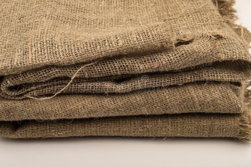 A few pieces of burlap. Fabric with a rough texture for sewing bags. surface texture Close-up.  stock images