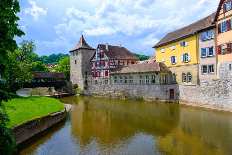 Historic houses, tower of city wall and ancient wooden bridge in Schwabisch Hall, Germany stock photo