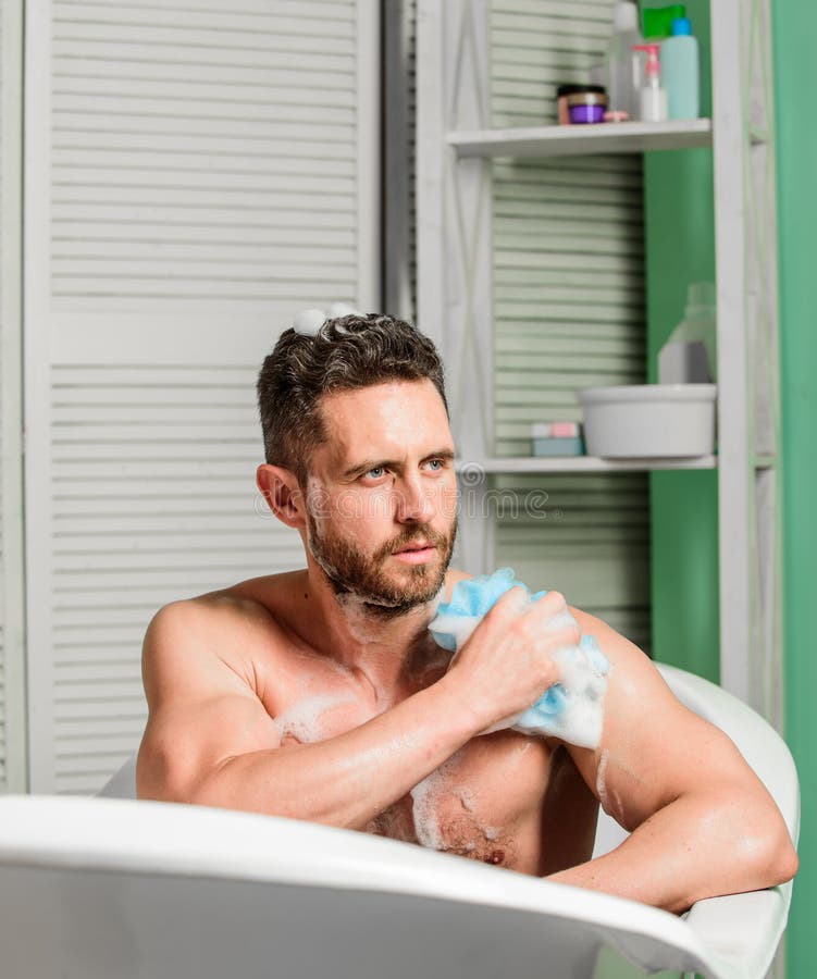 Hygiene and health. Morning shower. man wash muscular body with foam sponge. macho man washing in bath. pe