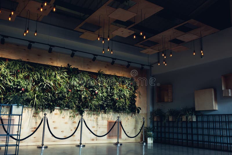 Interior design of modern hotel lobby. Shopping center hall. Business center hallway. Wall with plants. Interior design of modern hotel lobby. Shopping center royalty free stock image