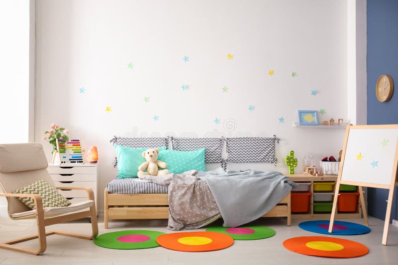 Modern child room interior with comfortable bed. And armchair royalty free stock photos