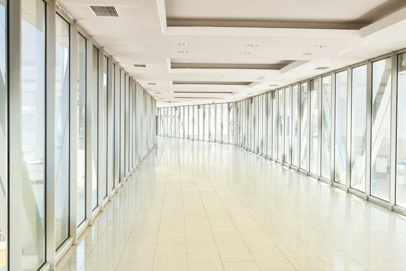 Panoramic view on empty office hall with glass wall windows. made of metal and glass. Modern corridor metal and glass construction. Commercial architecture royalty free stock photography