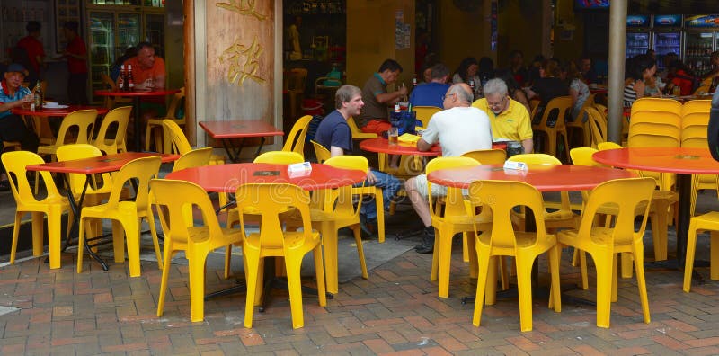 People eat at popular food hall in Chinatown royalty free stock images