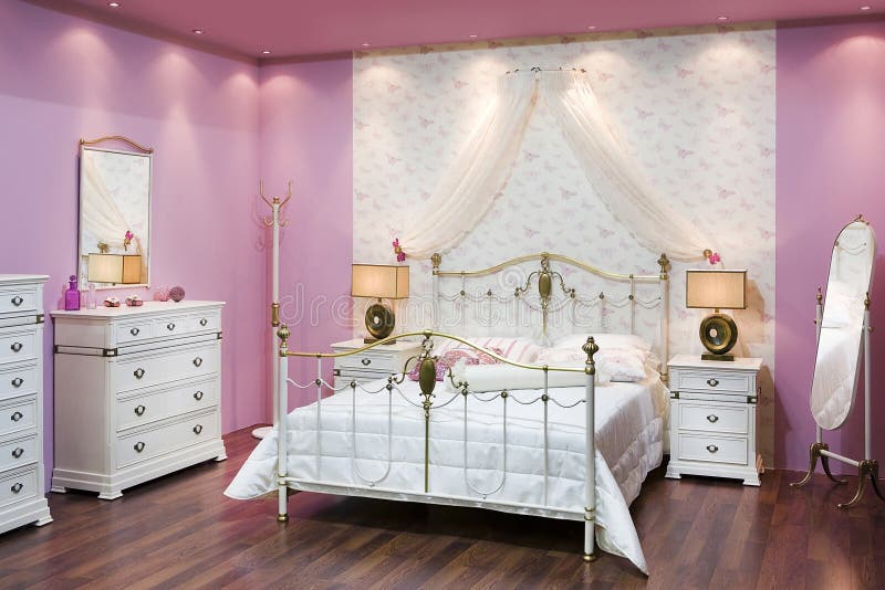 Pink bedroom. Classic bedroom with pink walls stock photography
