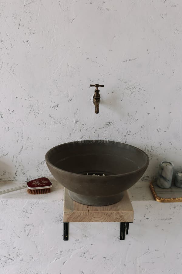 Retro stoned sink.  wash basin vintage. romantic vintage bathroom interior. Design loft in a modern style with wood and concrete. stock photography