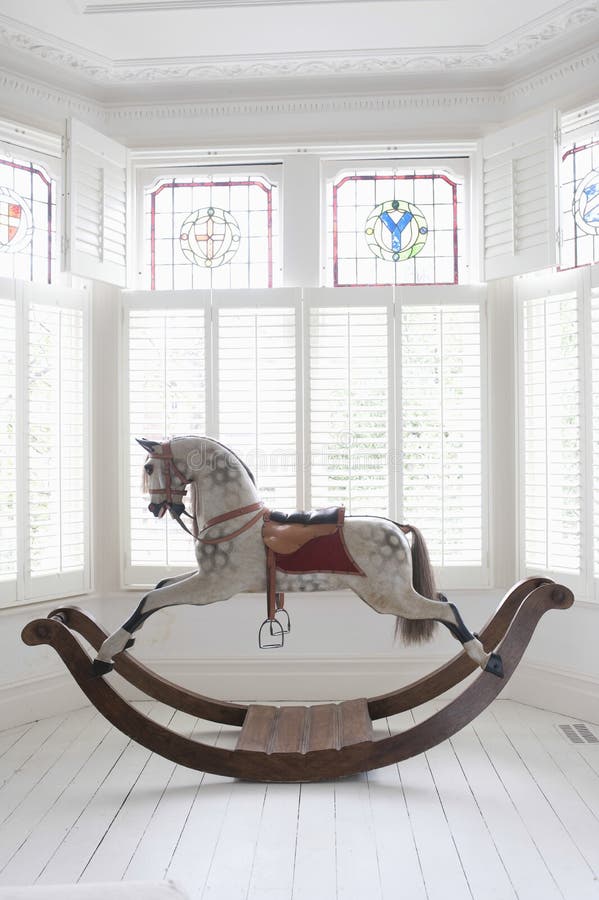 Rocking Horse In Bay Window stock photography