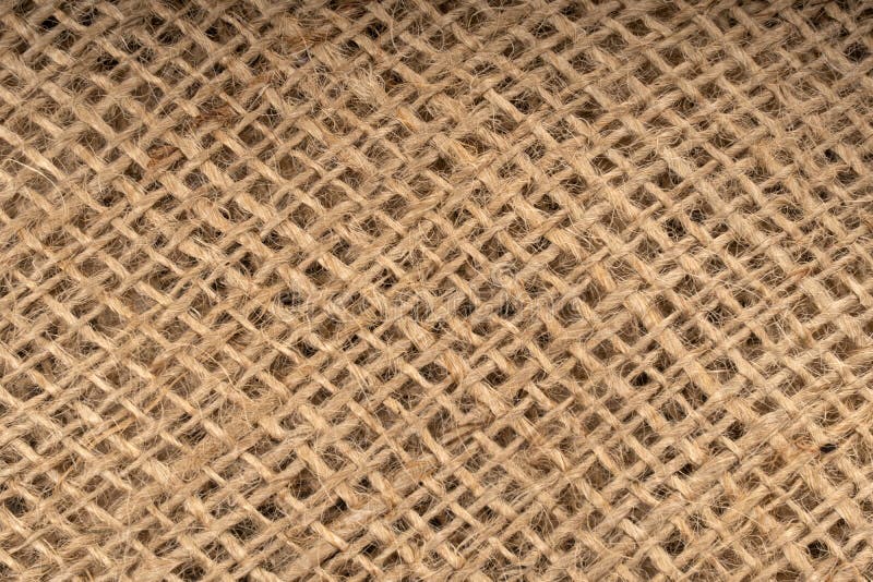 Rough fabric, burlap, sack background. Old woven threads royalty free stock images