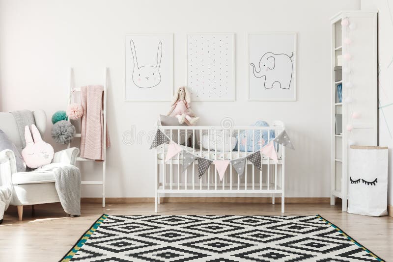 Scandi child`s room with bed. Geometric carpet in scandi child`s room with white bed, grey armchair and paper bag for toys stock image