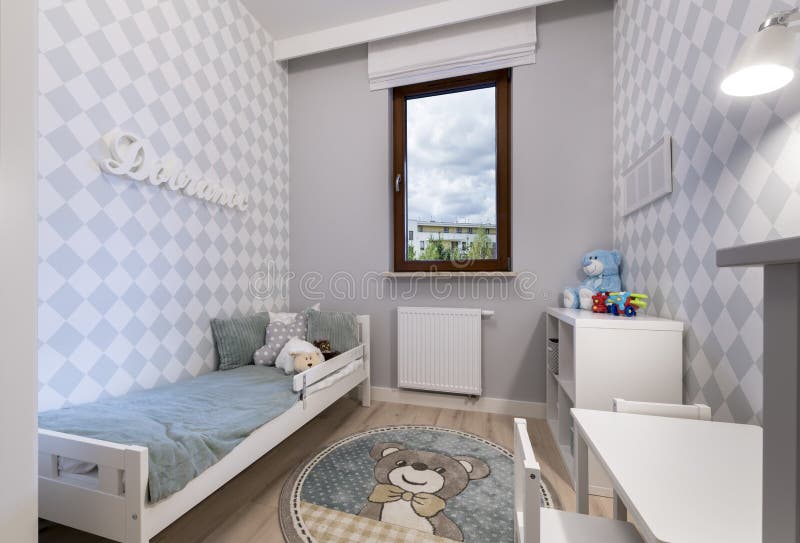 Small child room in modern apartment. Small child room in pastel blue color royalty free stock photography