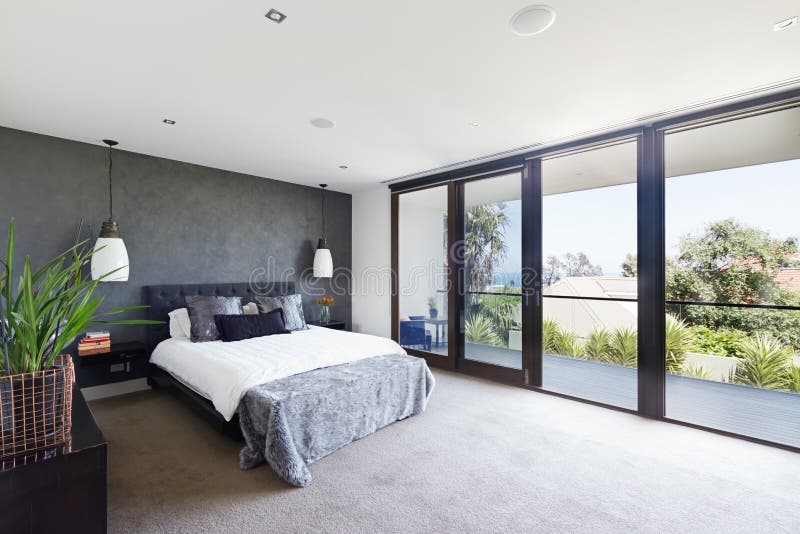 Spacious interior of designer master bedroom in luxury Australia royalty free stock photo