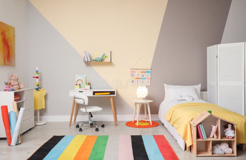 Stylish child room interior with bed and desk. Stylish child room interior with comfortable bed and desk stock images