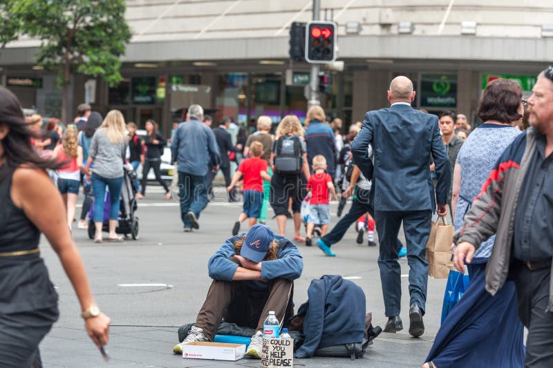 SYDNEY, AUSTRALIA - NOVEMBER 12, 2014: Homeless People in Sydney, Australia. Close to Town Hall, on George and Druitt Junction stock photos