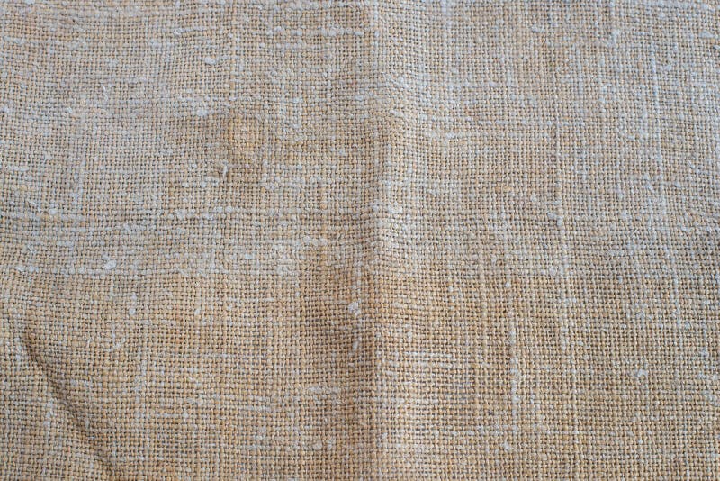 Texture of old rough beige burlap. Picture of texture of old rough beige burlap. Beautiful old texture royalty free stock images