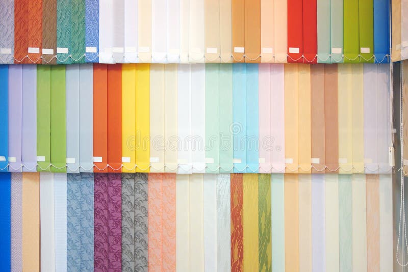 Vertical blinds. Background from multi-colored vertical blinds stock photo