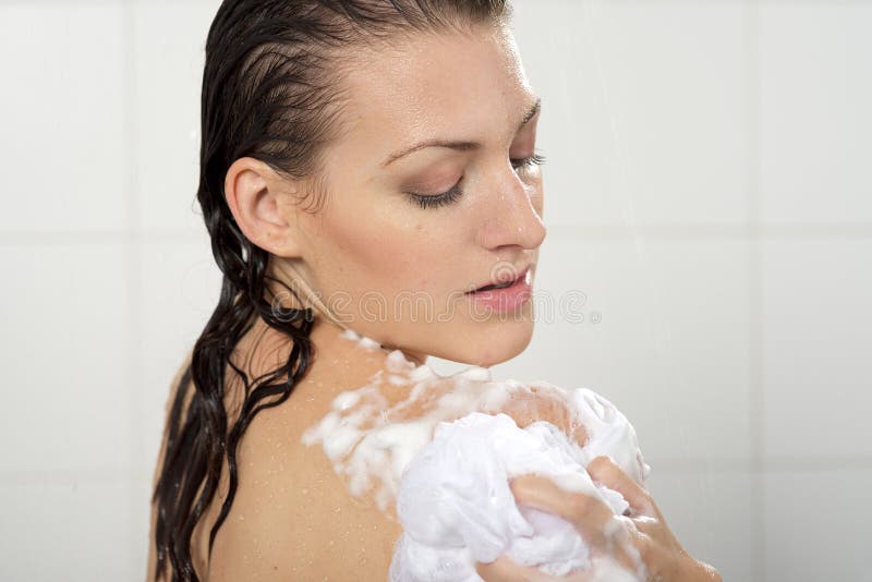 Woman washing her body shower gel. Beautiful woman washing her body shower gel stock photos