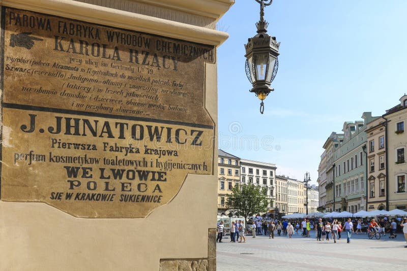 XIX century advertising saved on Sukiennice (Cloth Hall) wall. Historic building on Main Square royalty free stock image