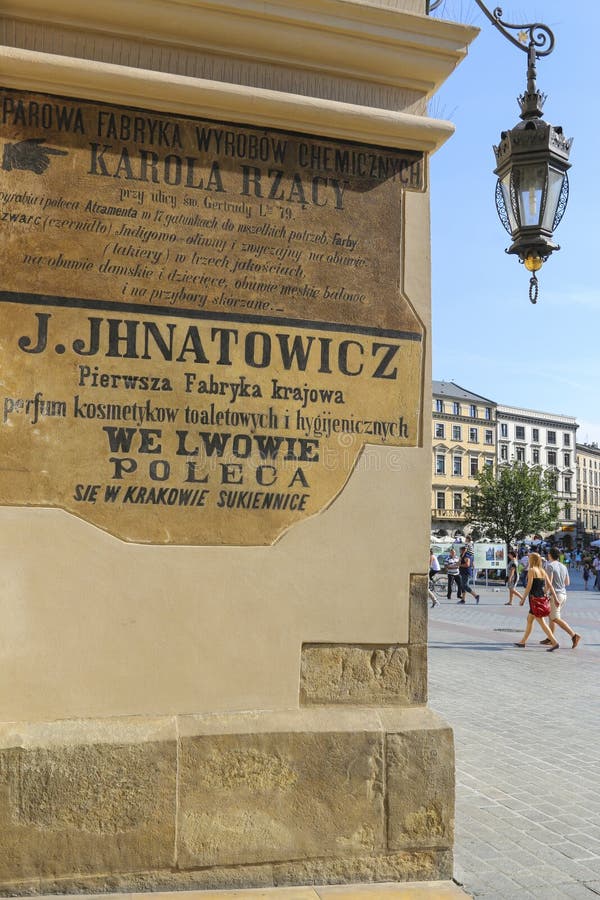 XIX century advertising saved on Sukiennice (Cloth Hall) wall. Historic building on Main Square stock photo